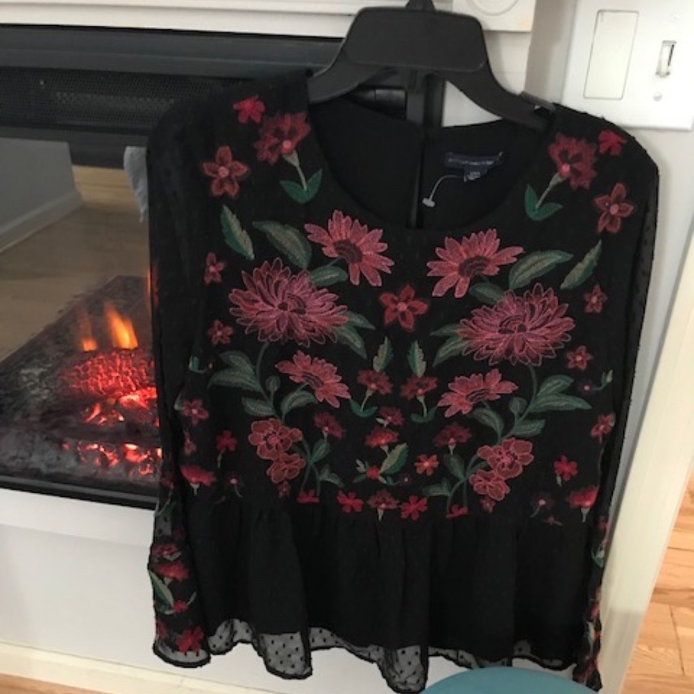 Light and airy embroidered peplum top